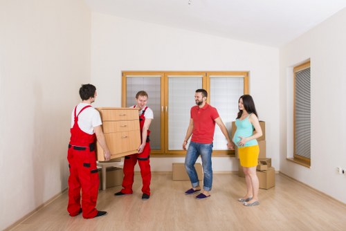 Professional moving service handling large furniture