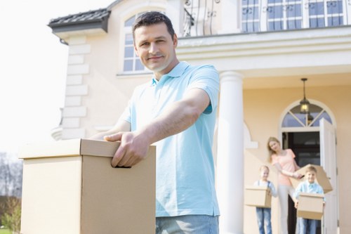 Professional movers assisting with house relocation